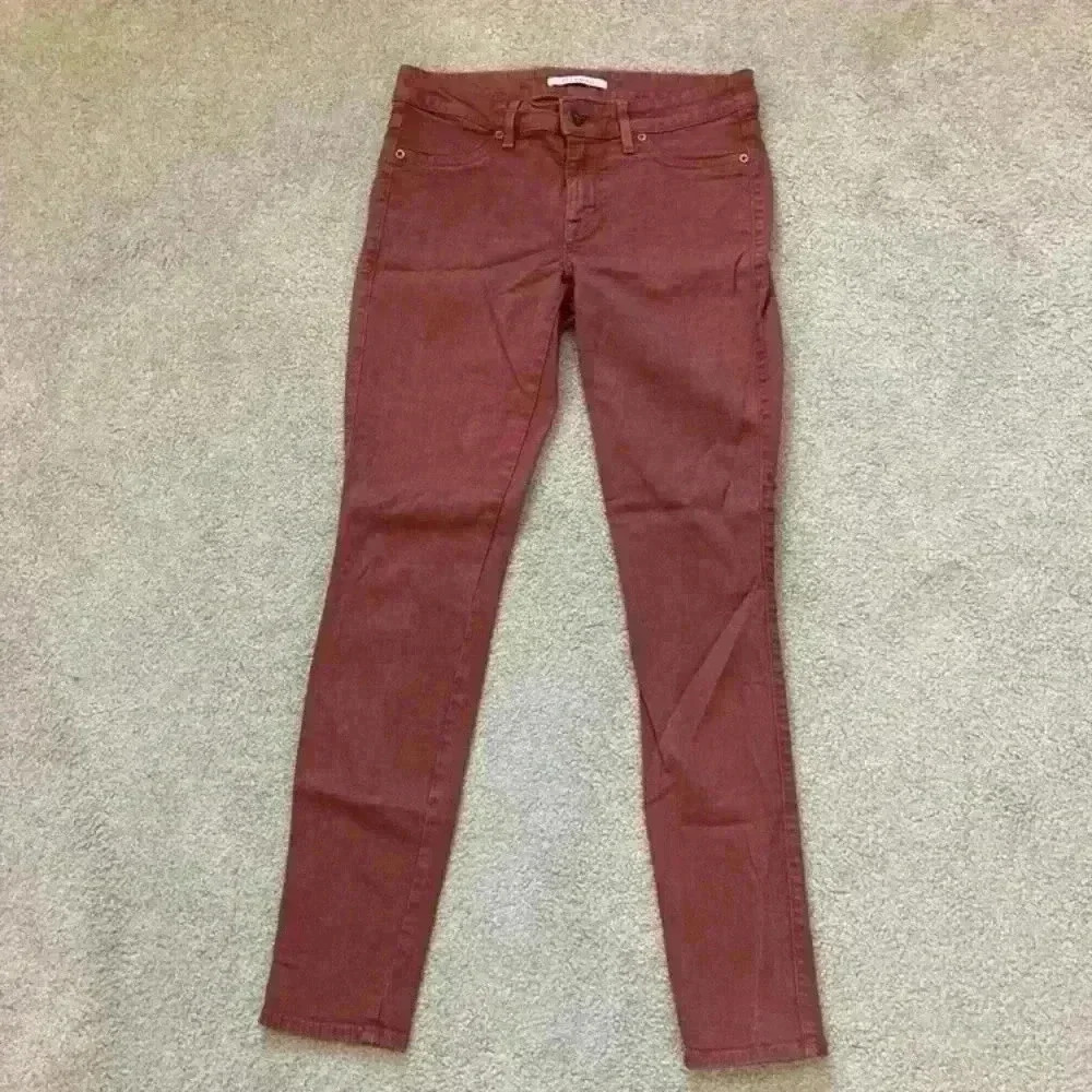 Rich and skinny burnt orange brown skinny jeans in size 27